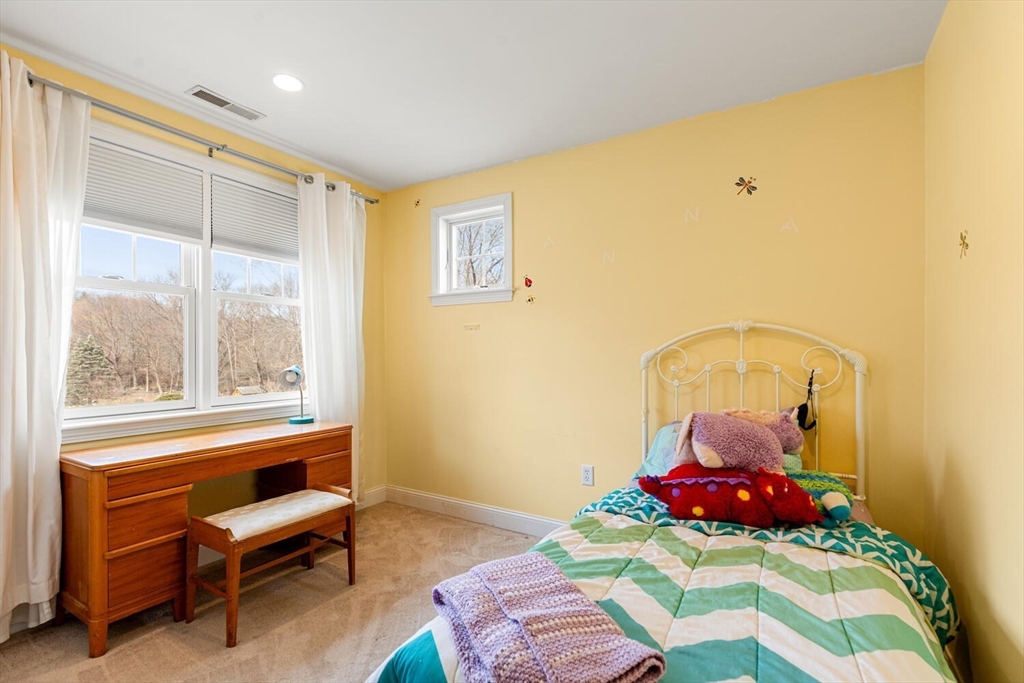 56 Grapevine Avenue Lexington, MA 02421 - Photo 29 of 38 a bedroom with a bed and a window