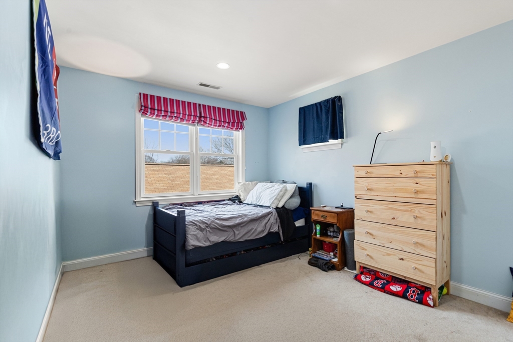 56 Grapevine Avenue Lexington, MA 02421 - Photo 30 of 38 a bedroom with a bed and a window