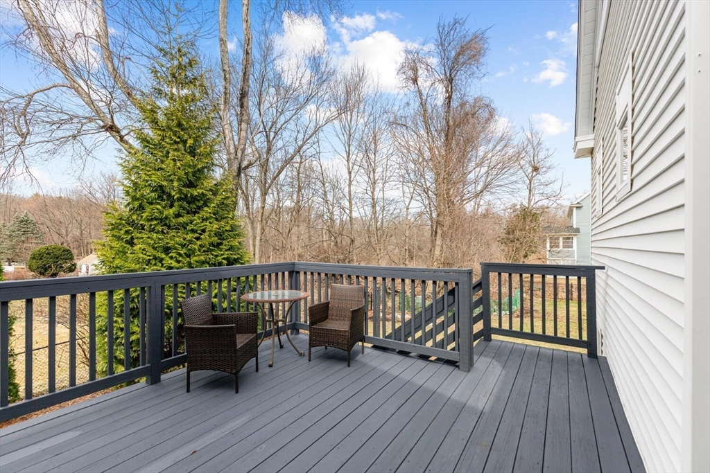56 Grapevine Avenue Lexington, MA 02421 - Photo 35 of 38 a view of balcony with wooden floor and outdoor seating