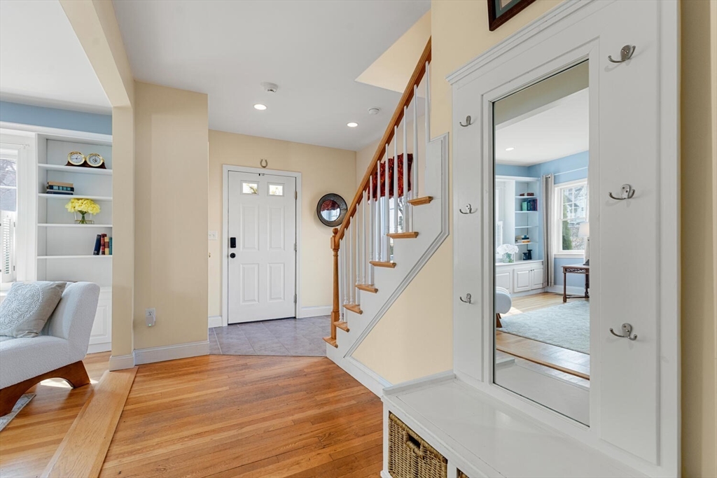 56 Grapevine Avenue Lexington, MA 02421 - Photo 6 of 38 a view of a hallway with wooden floor and staircase