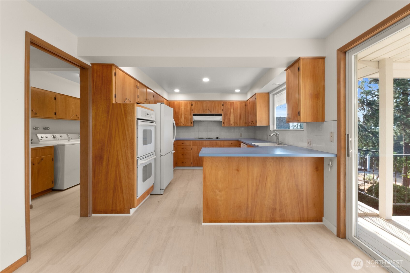 2811 West Weile Avenue Spokane, WA 99208 - Photo 12 of 39 a view of a kitchen with a sink and cabinets