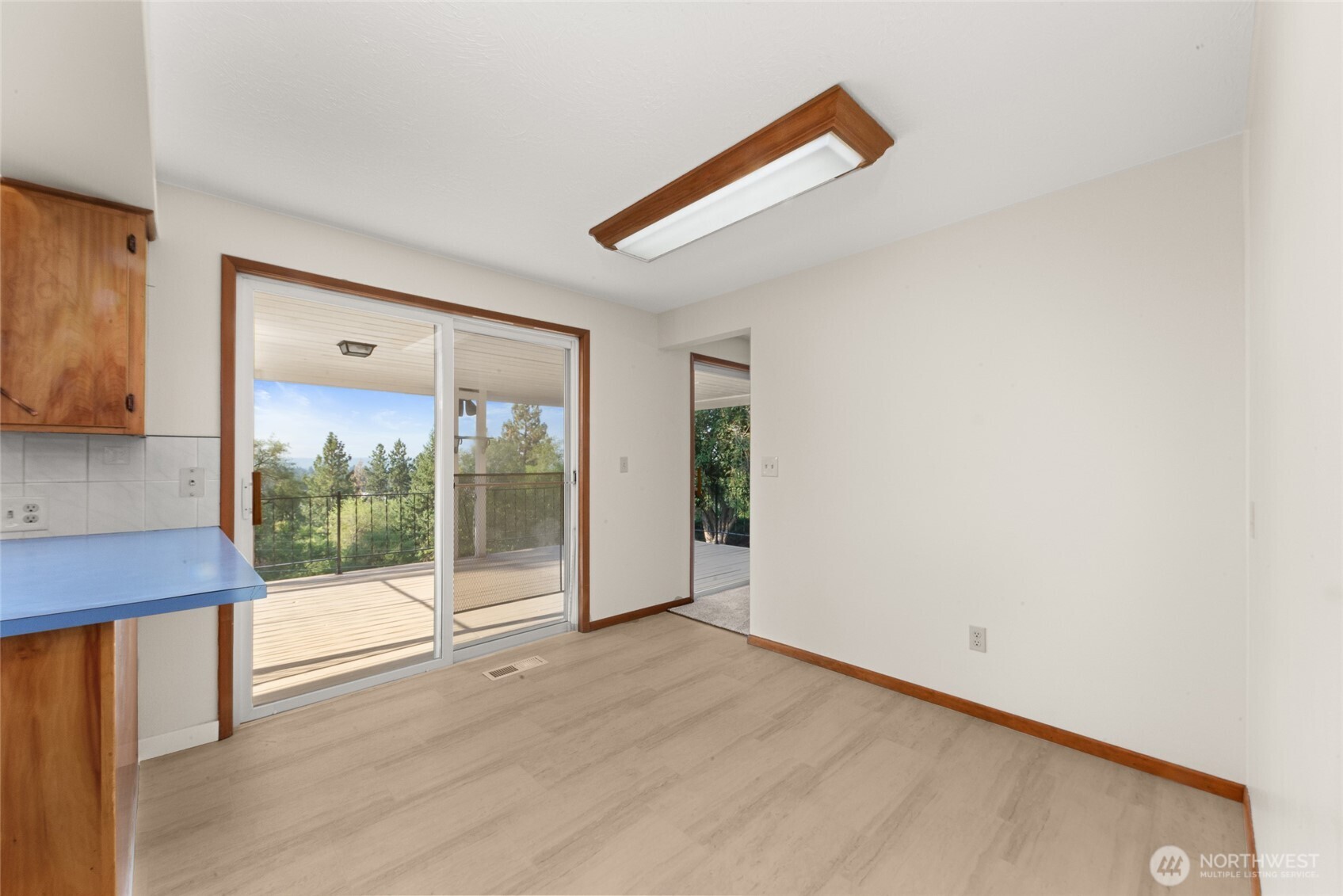 2811 West Weile Avenue Spokane, WA 99208 - Photo 14 of 39 a view of a room with wooden floor and a window