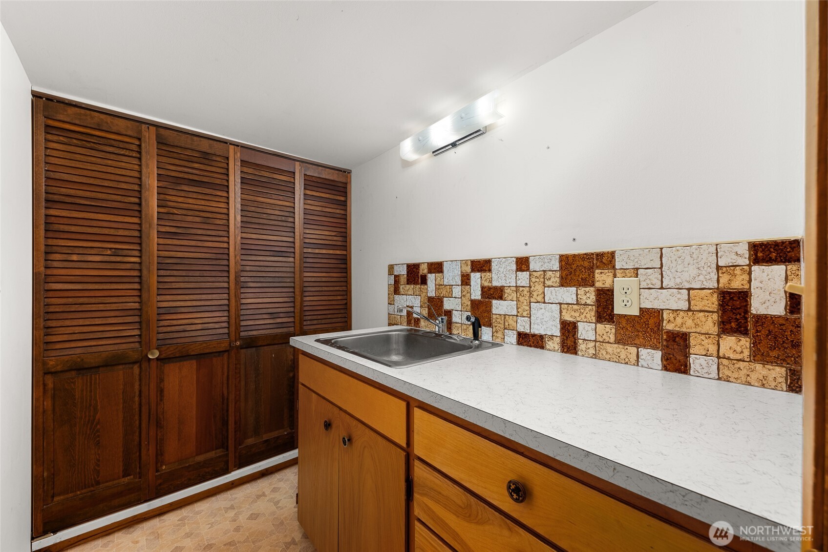2811 West Weile Avenue Spokane, WA 99208 - Photo 29 of 39 a kitchen with a sink and a large window