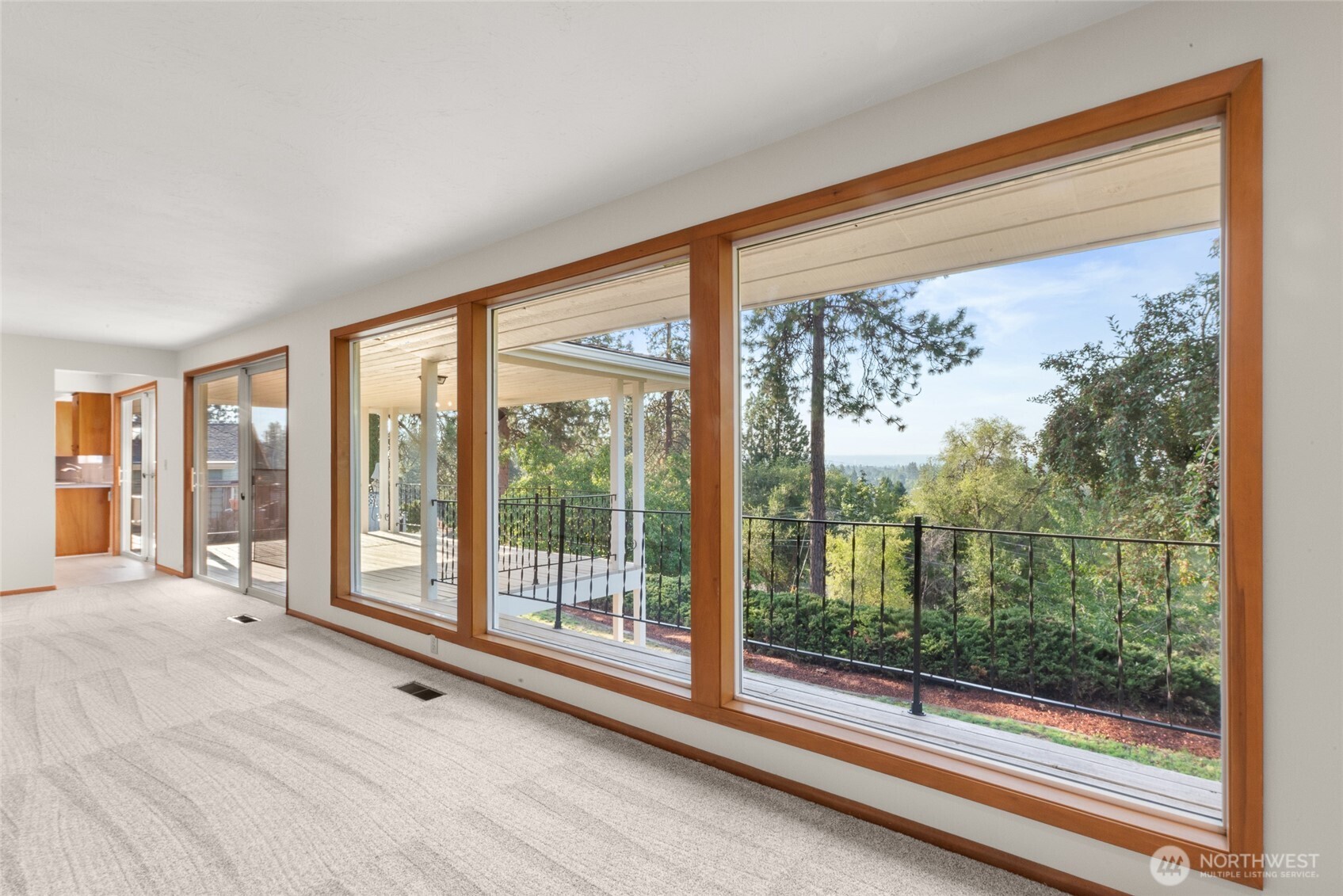 2811 West Weile Avenue Spokane, WA 99208 - Photo 8 of 39 a view of a room with wooden floor and windows