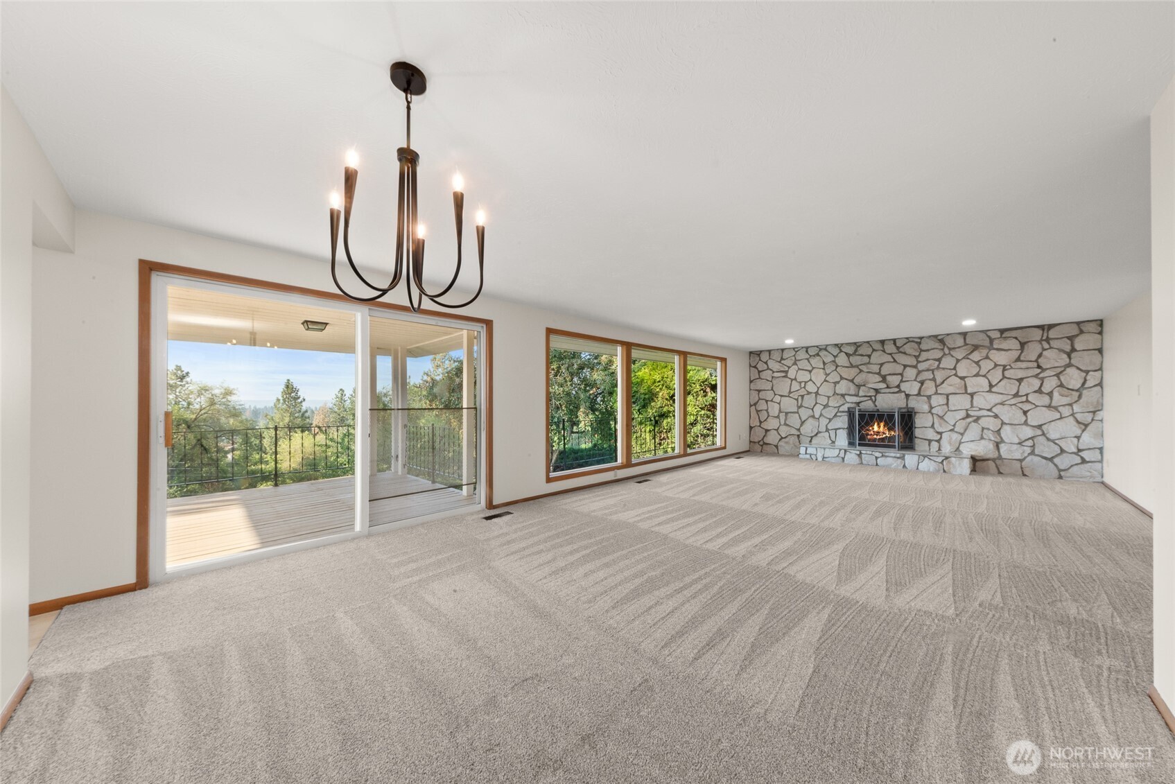 2811 West Weile Avenue Spokane, WA 99208 - Photo 10 of 39 a view of a room with a flat screen tv and windows