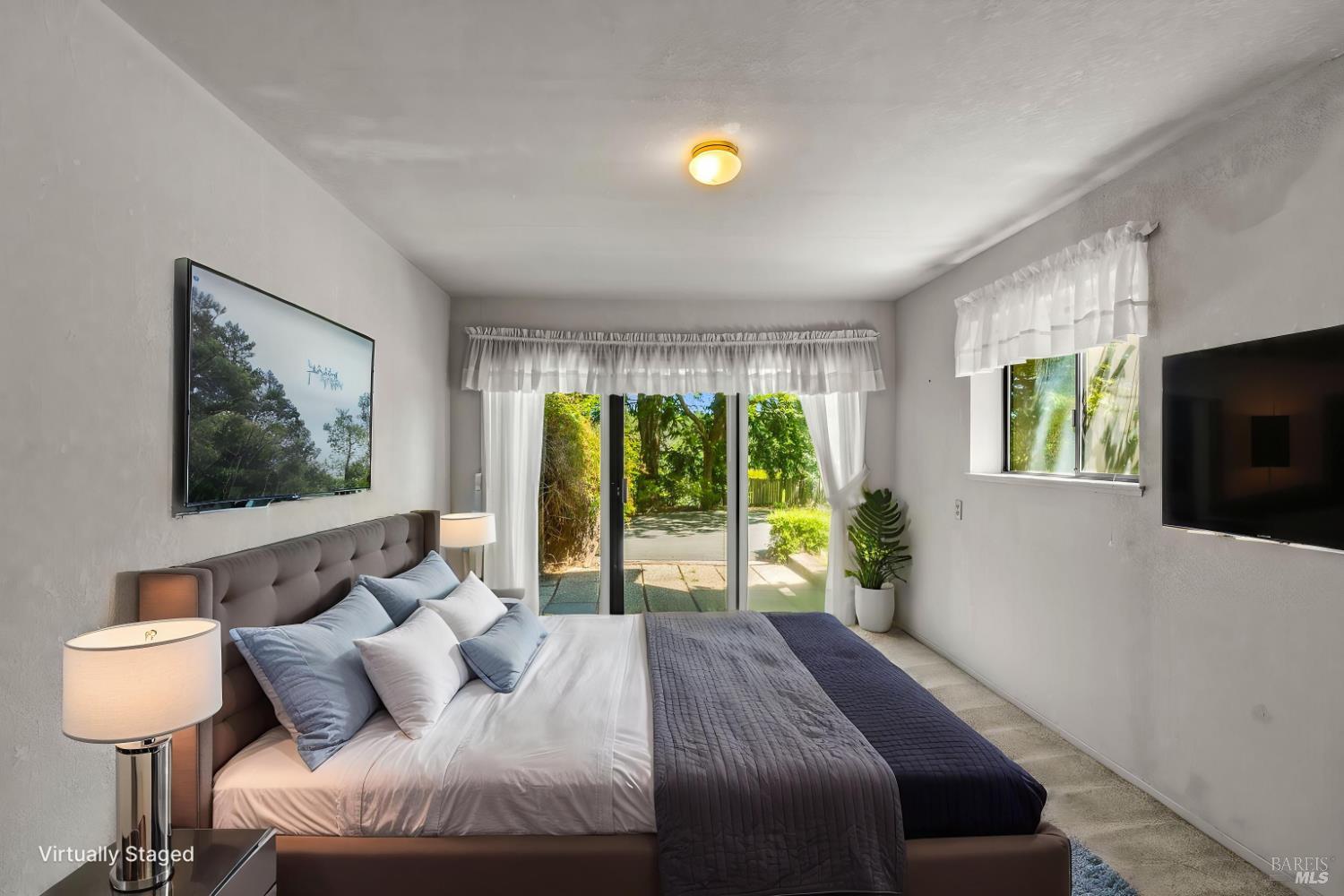 625-629 Hill Road Angwin, CA 94508 - Photo 52 of 64 a bedroom with a bed and a flat screen tv