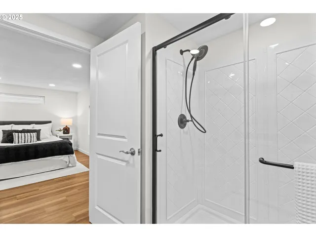 a en suite bathroom with a shower and a bathroom