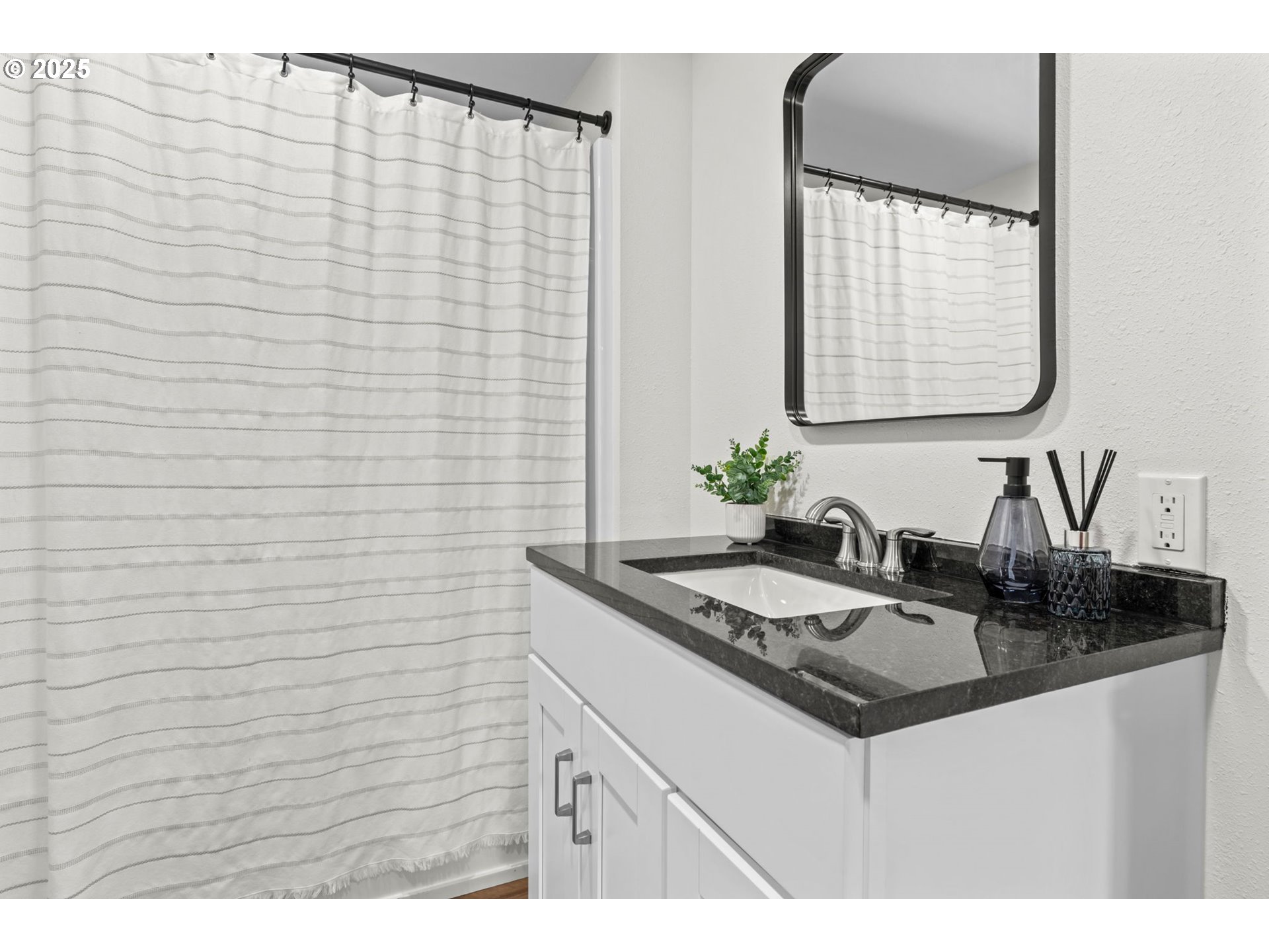 27645 Snyder Road Junction City, OR 97448 - Photo 23 of 41 a bathroom with a sink and a mirror