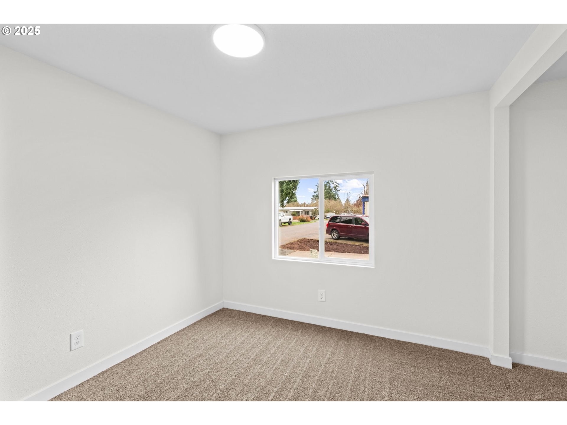 27645 Snyder Road Junction City, OR 97448 - Photo 25 of 41 a view of an empty room with a window