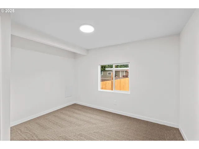 a view of an empty room and window