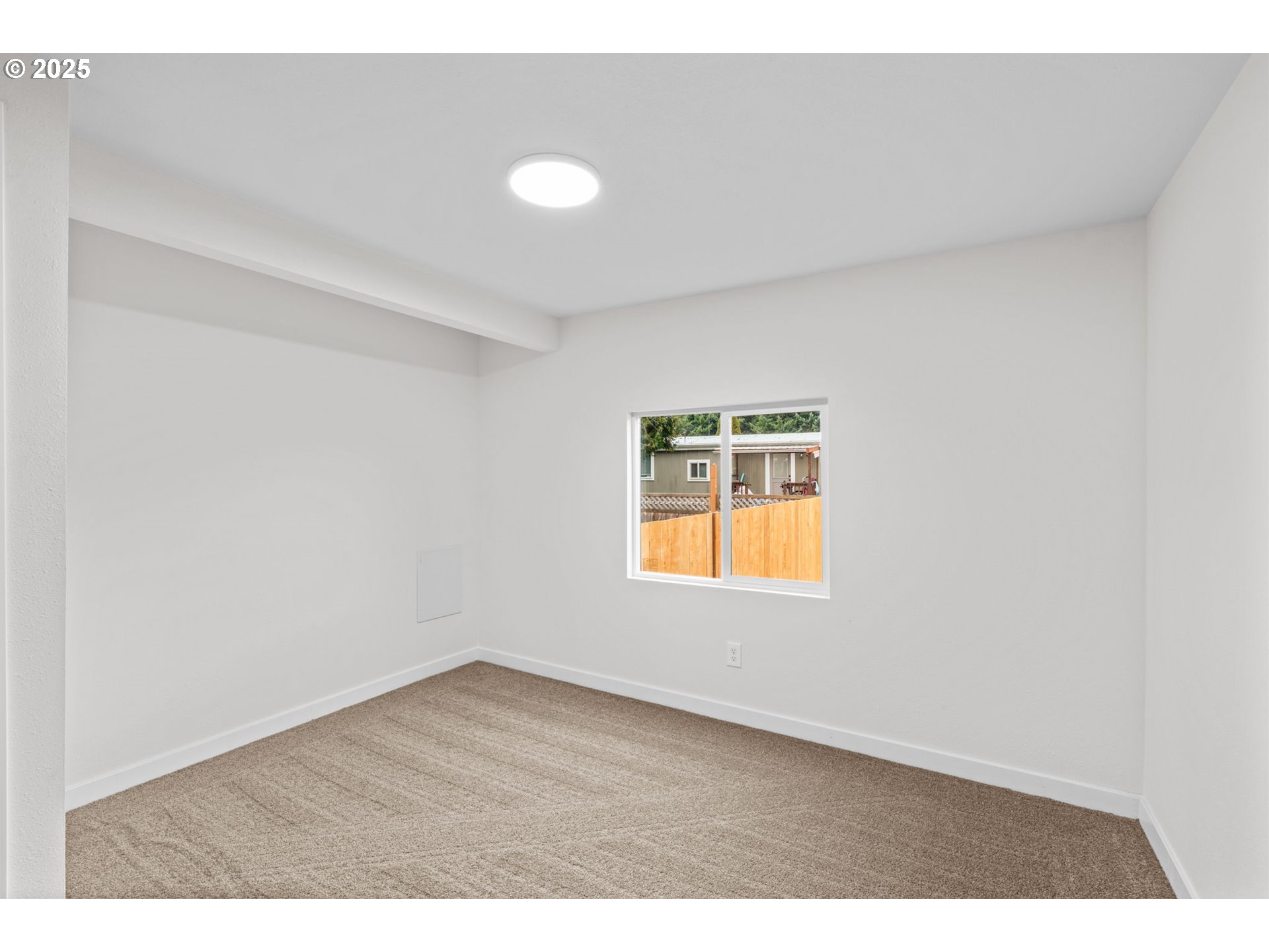 27645 Snyder Road Junction City, OR 97448 - Photo 28 of 41 a view of an empty room and window