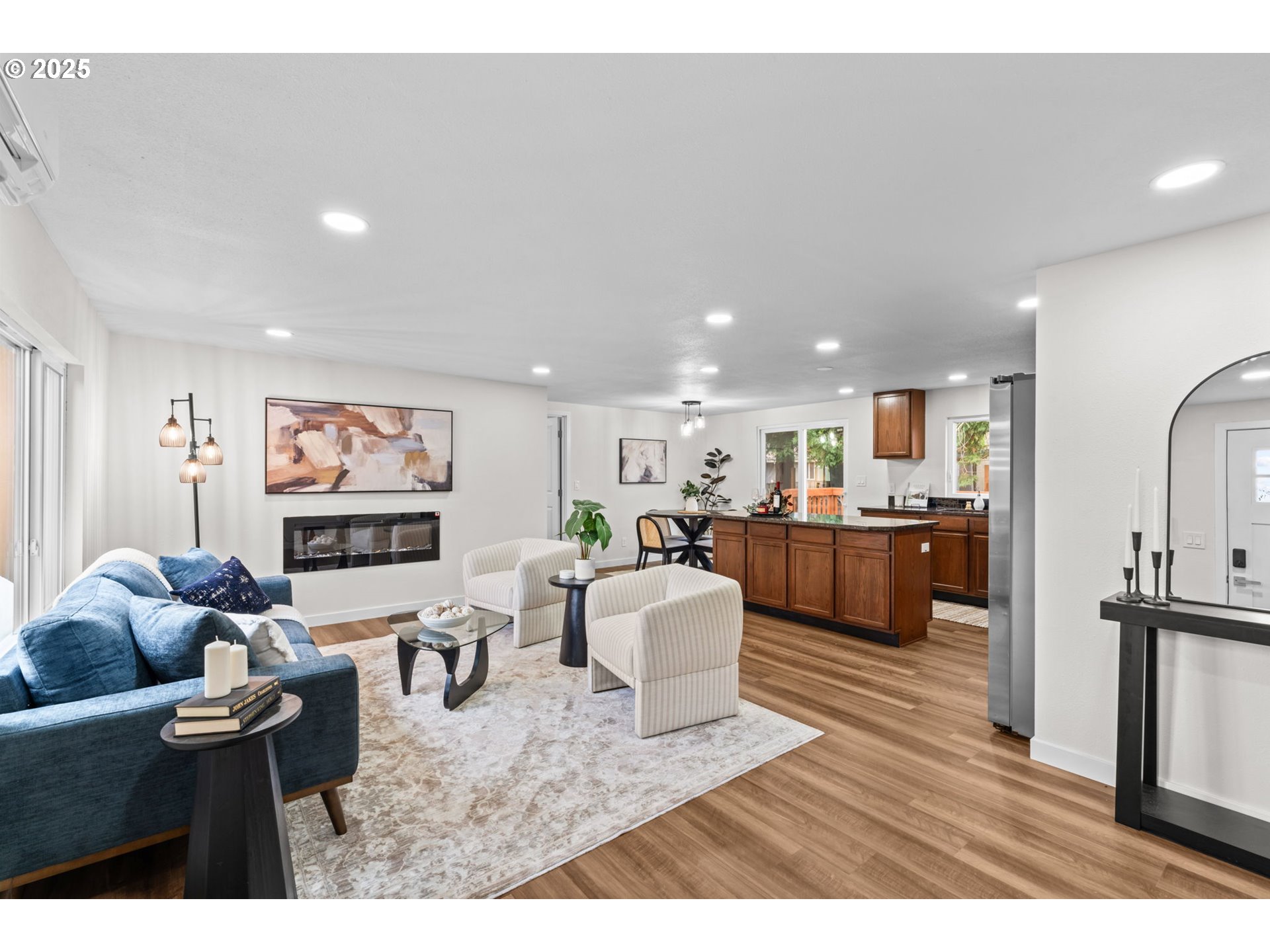 27645 Snyder Road Junction City, OR 97448 - Photo 3 of 41 a living room with furniture kitchen view and a wooden floor