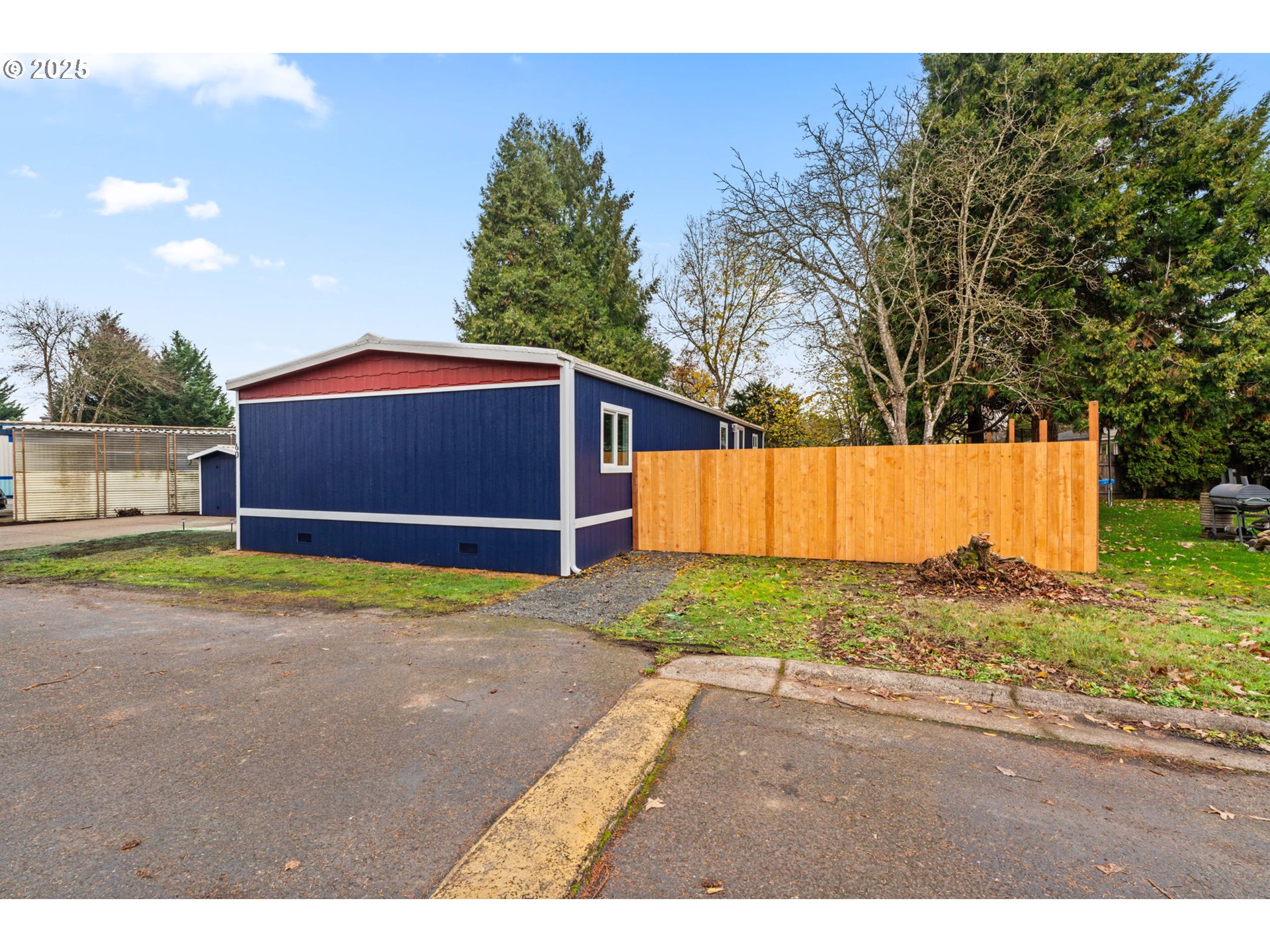 27645 Snyder Road Junction City, OR 97448 - Photo 31 of 41 a backyard of a house with yard and trampoline