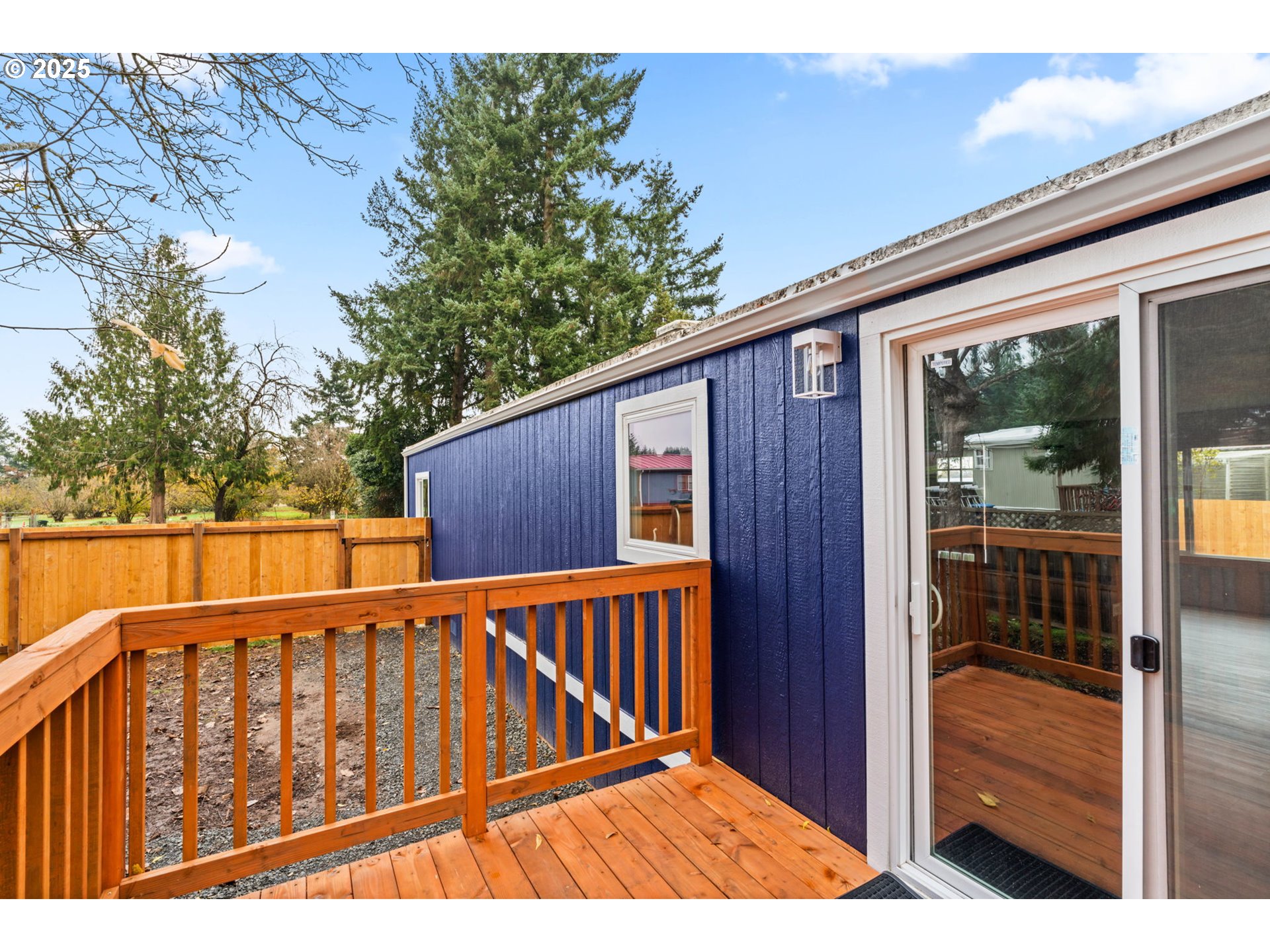 27645 Snyder Road Junction City, OR 97448 - Photo 35 of 41 a balcony with wooden floor and yard in the back