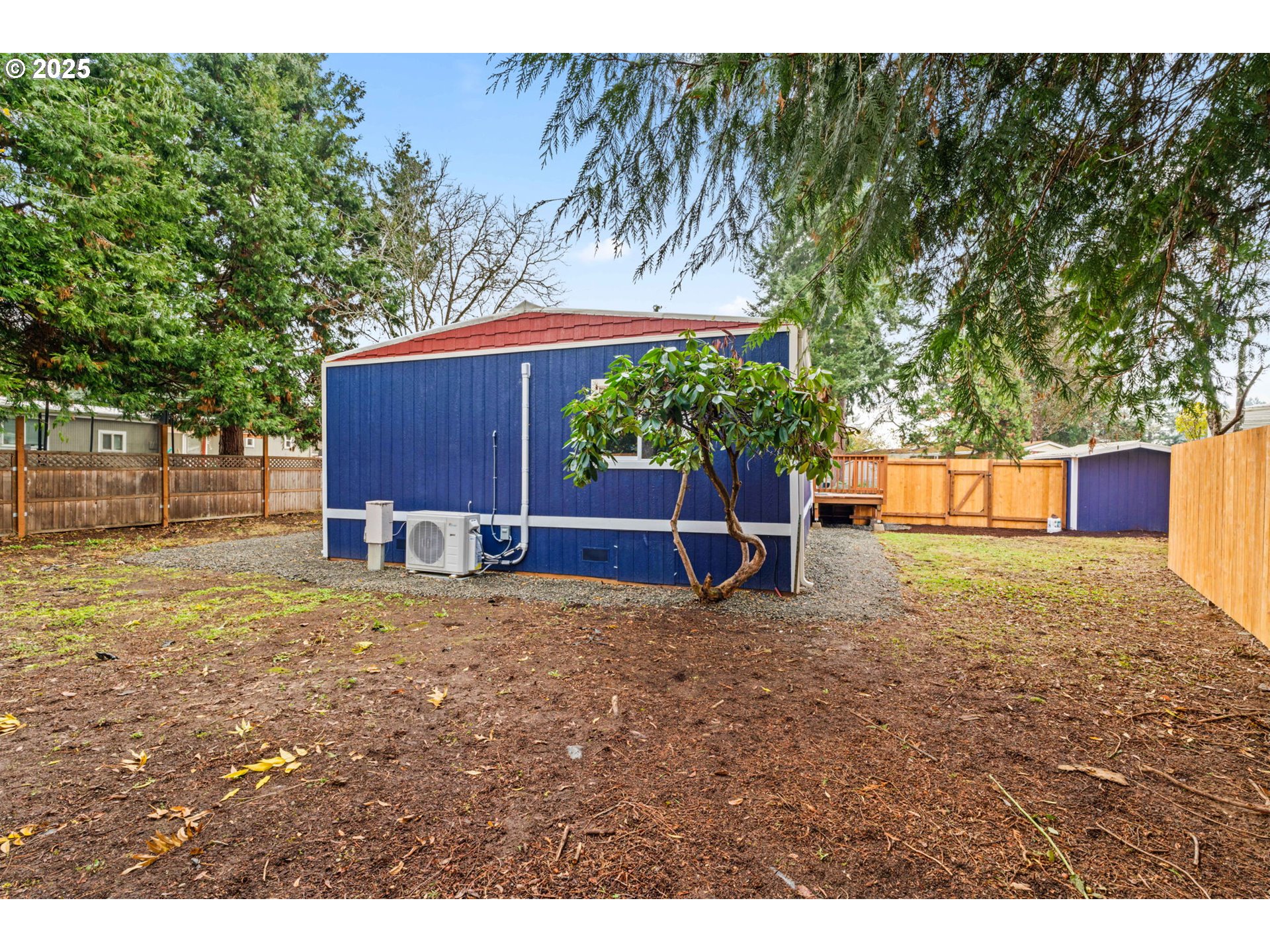 27645 Snyder Road Junction City, OR 97448 - Photo 37 of 41 a backyard of a house with a yard and outdoor seating