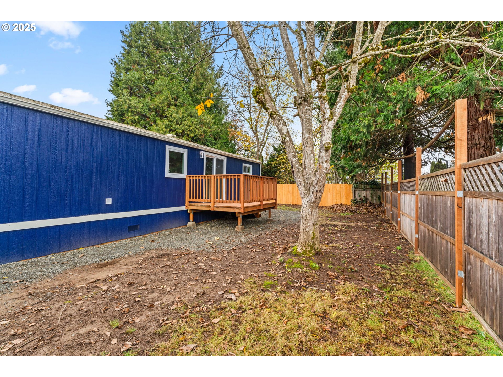 27645 Snyder Road Junction City, OR 97448 - Photo 39 of 41 a view of a backyard with wooden fence and large trees