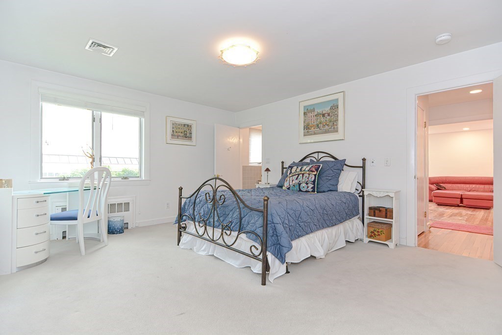 14 Columbine Road Newton, MA 02459 - Photo 17 of 36 a bedroom with a bed and a lamp