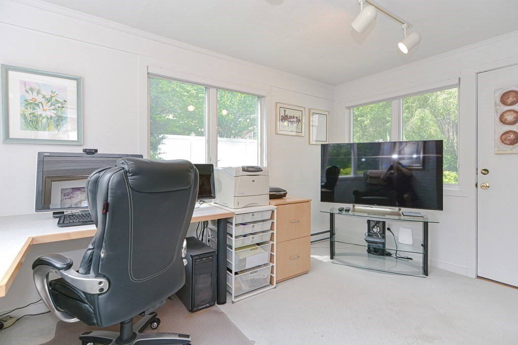 14 Columbine Road Newton, MA 02459 - Photo 18 of 36 a living room with furniture and a flat screen tv