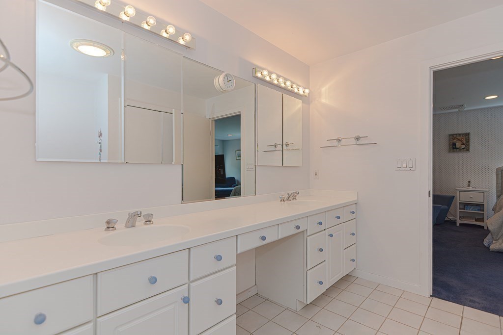 14 Columbine Road Newton, MA 02459 - Photo 26 of 36 a spacious bathroom with double sink and a mirror