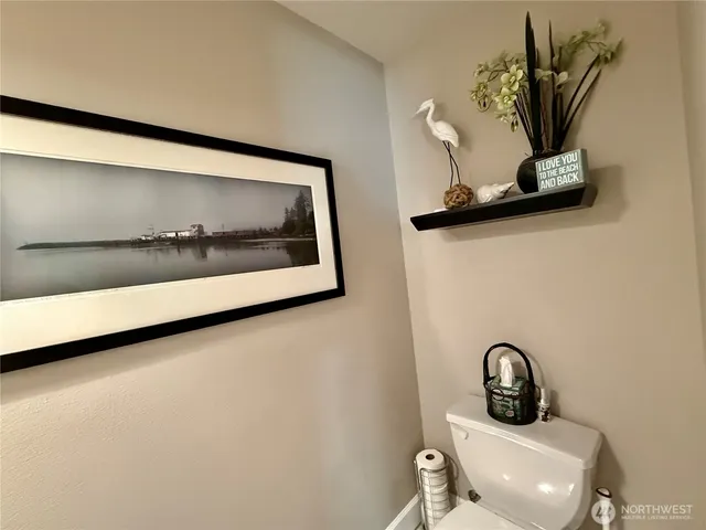 a bathroom with a sink mirror and vanity