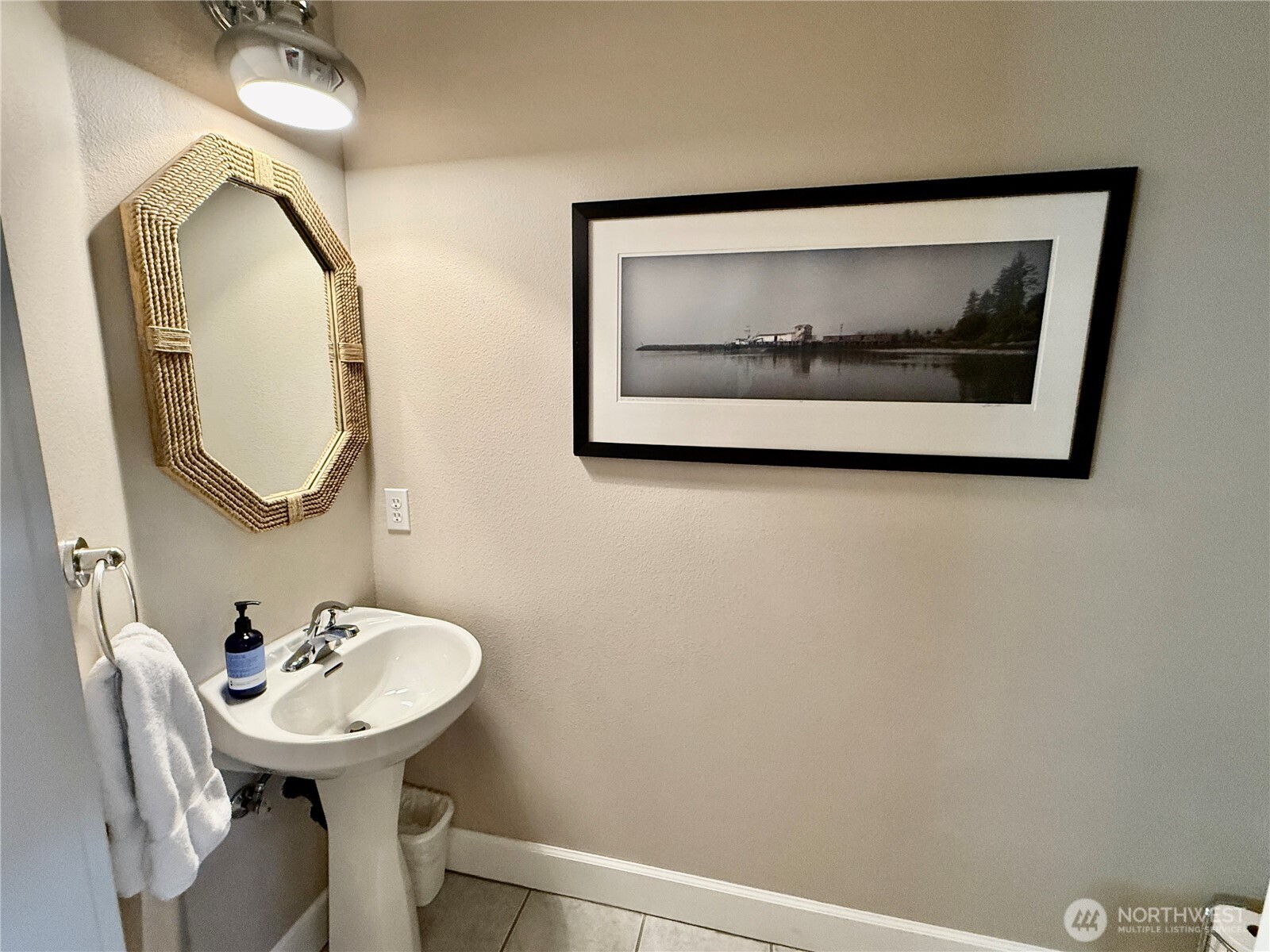 2815 Willows Road, Unit 210 Seaview, WA 98644 - Photo 20 of 35 a bathroom with a sink mirror and vanity