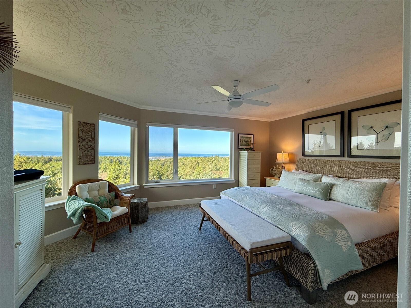 2815 Willows Road, Unit 210 Seaview, WA 98644 - Photo 24 of 35 a bedroom with a bed and large windows