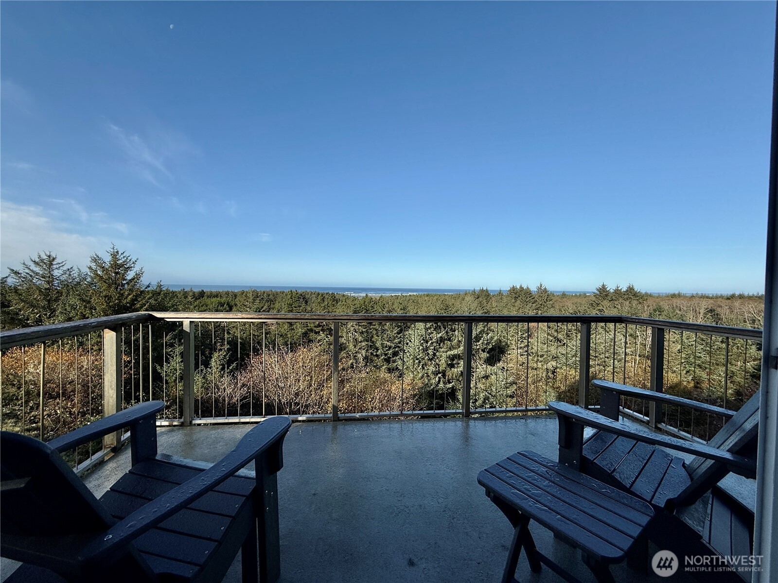 2815 Willows Road, Unit 210 Seaview, WA 98644 - Photo 3 of 35 a view of a balcony with wooden floor and outdoor seating