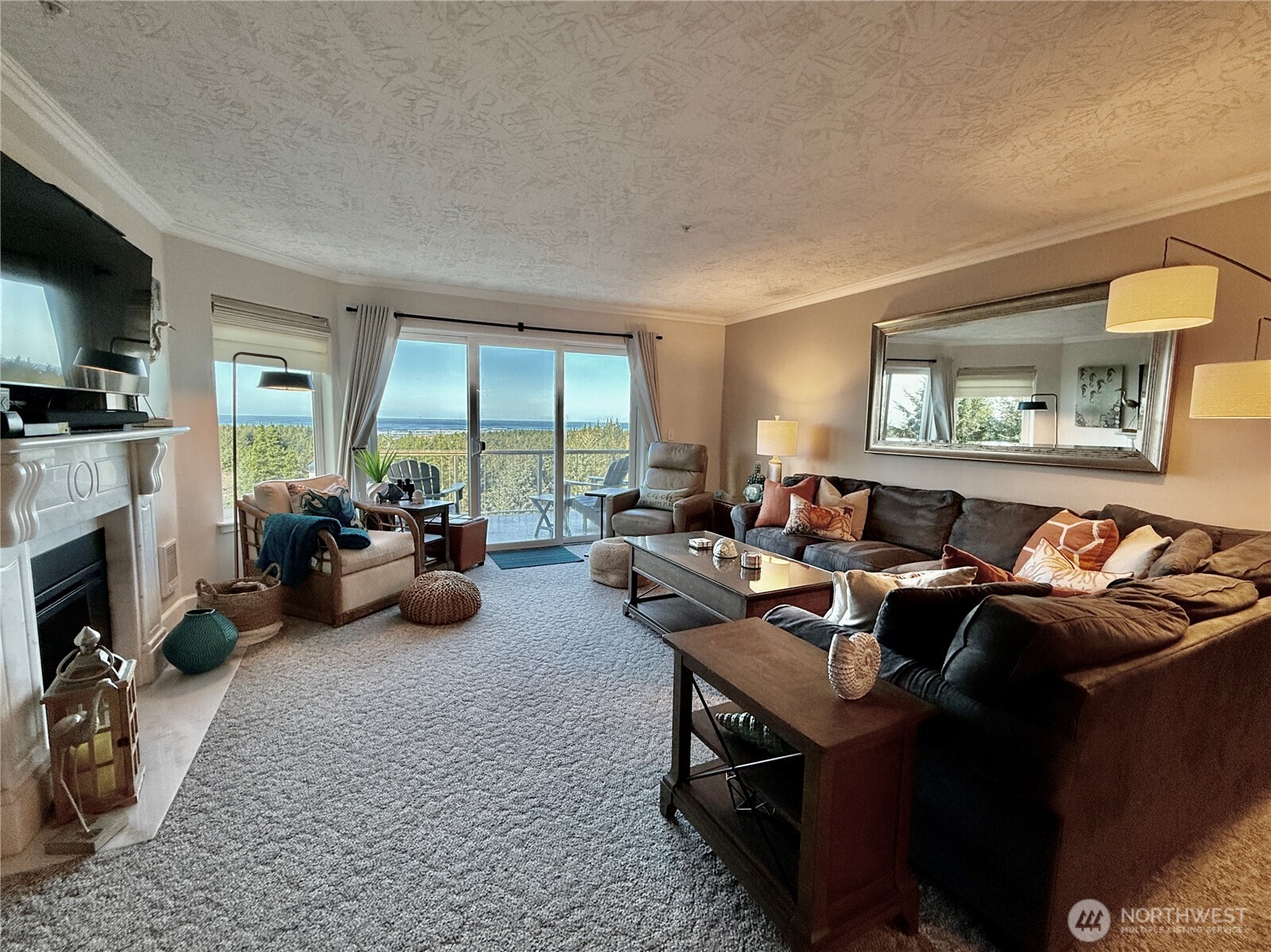 2815 Willows Road, Unit 210 Seaview, WA 98644 - Photo 7 of 35 a living room with furniture and a fireplace