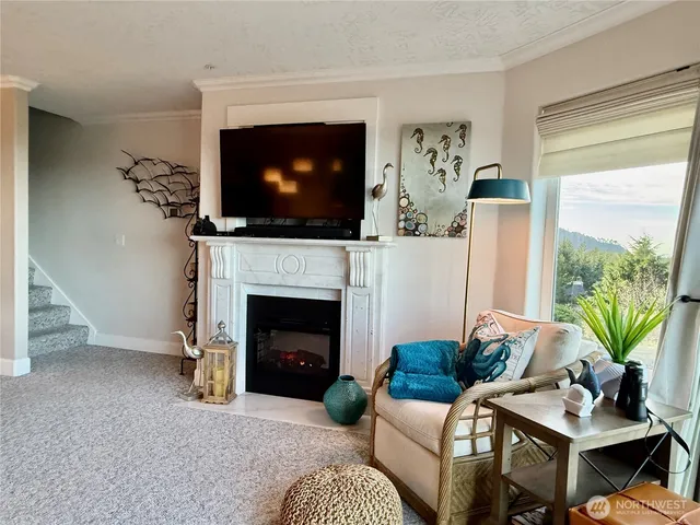 a living room with furniture and a large window