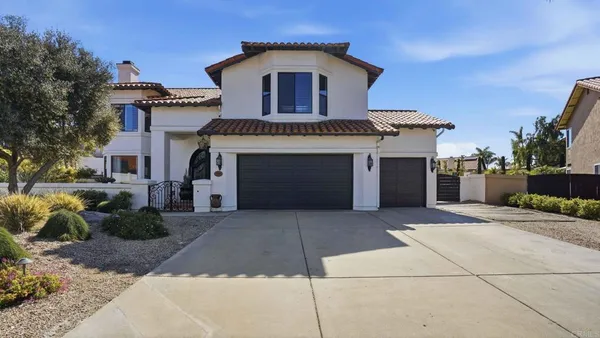 a front view of a house with a garage