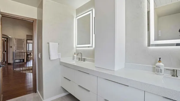 a view of a hallway and washer and dryer