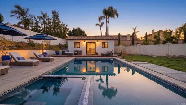 a view of a house with swimming pool