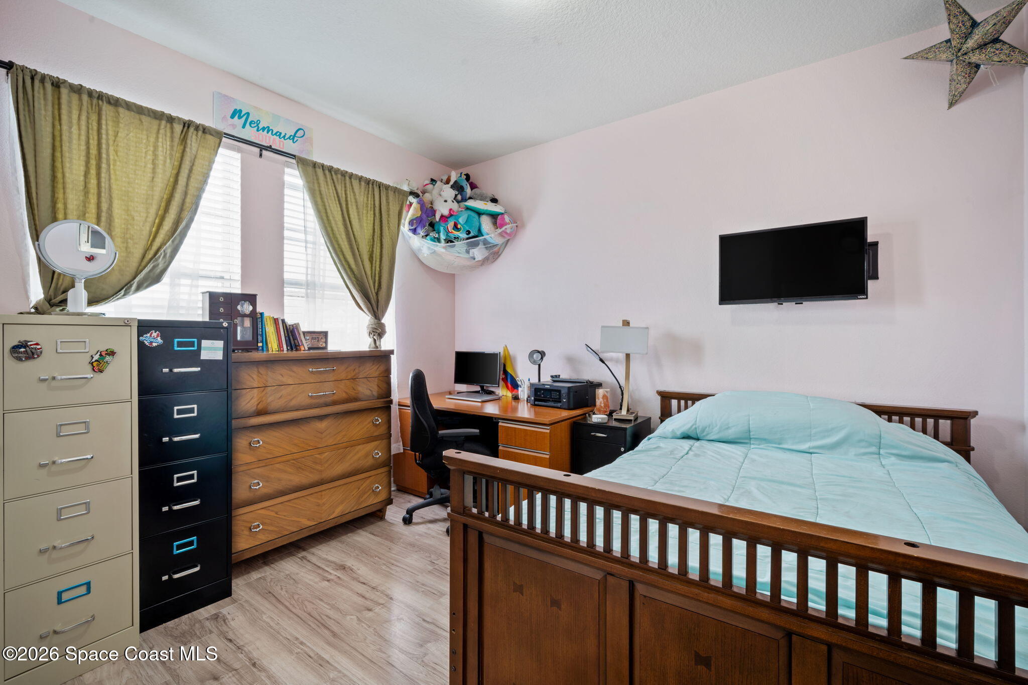 1941 Partin Terrace Road Kissimmee, FL 34744 - Photo 13 of 36 a bedroom with furniture and a window