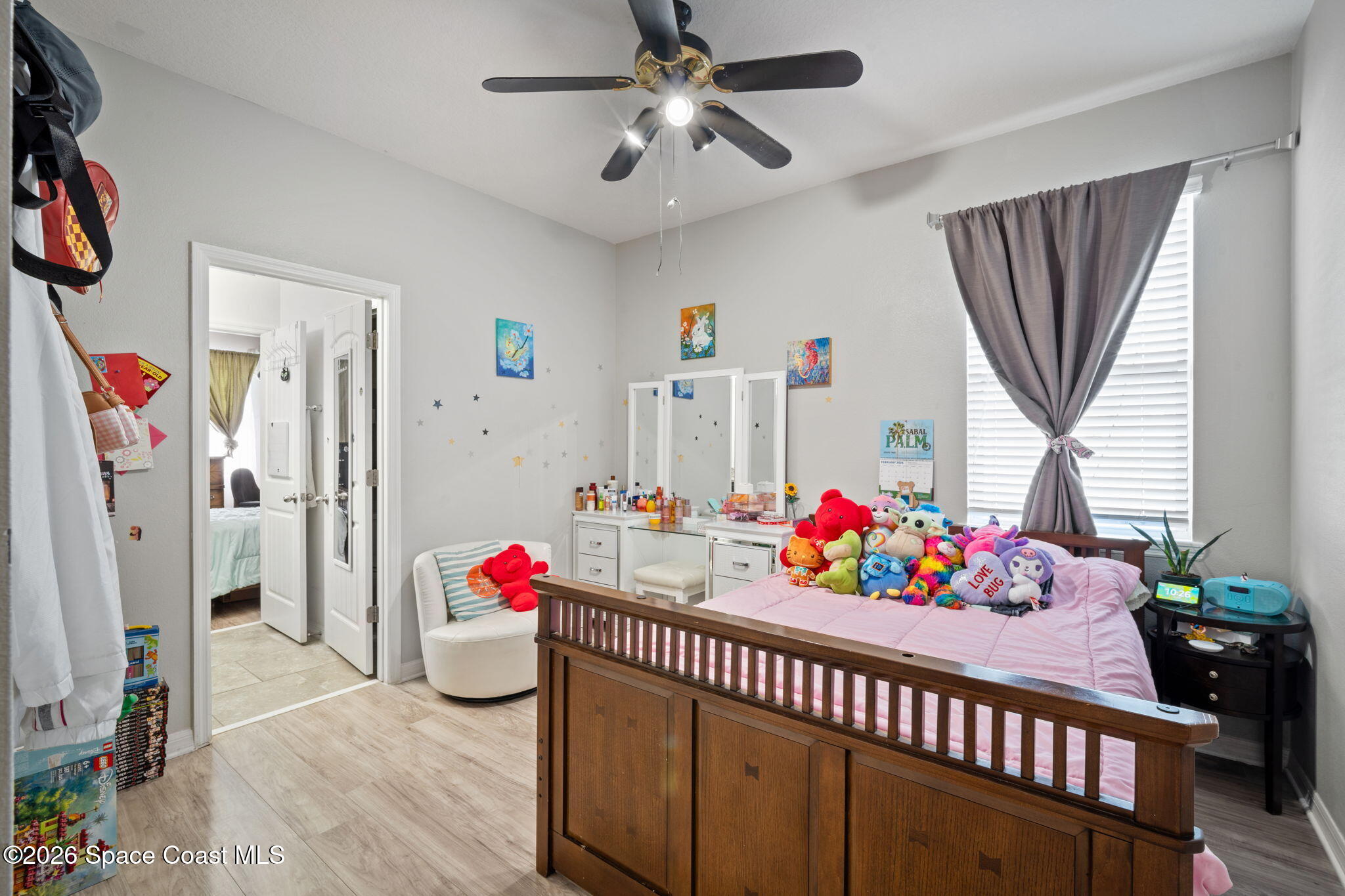 1941 Partin Terrace Road Kissimmee, FL 34744 - Photo 18 of 36 a bedroom with furniture a rug toys and a window