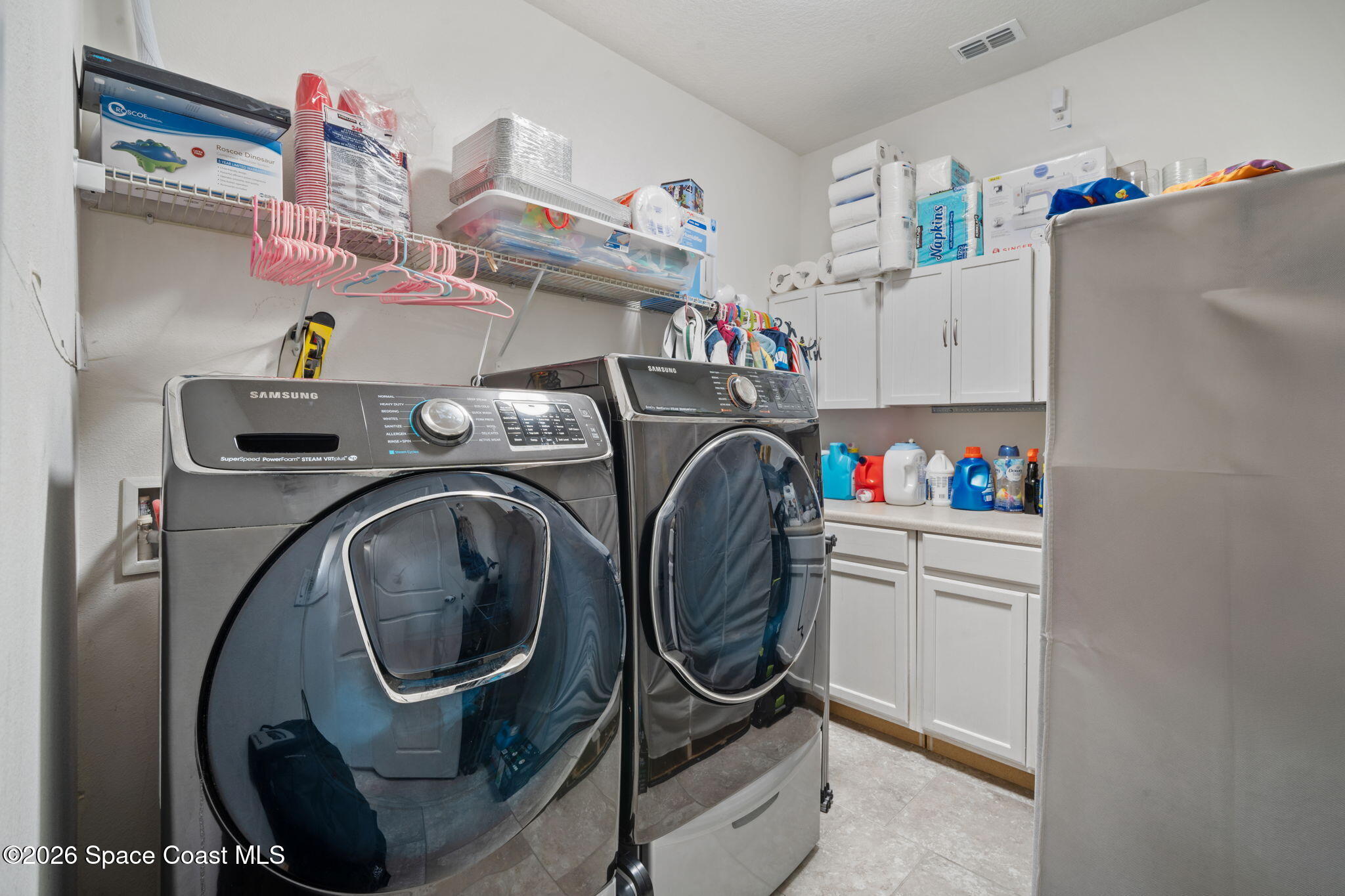1941 Partin Terrace Road Kissimmee, FL 34744 - Photo 22 of 36 a utility room with dryer and washer