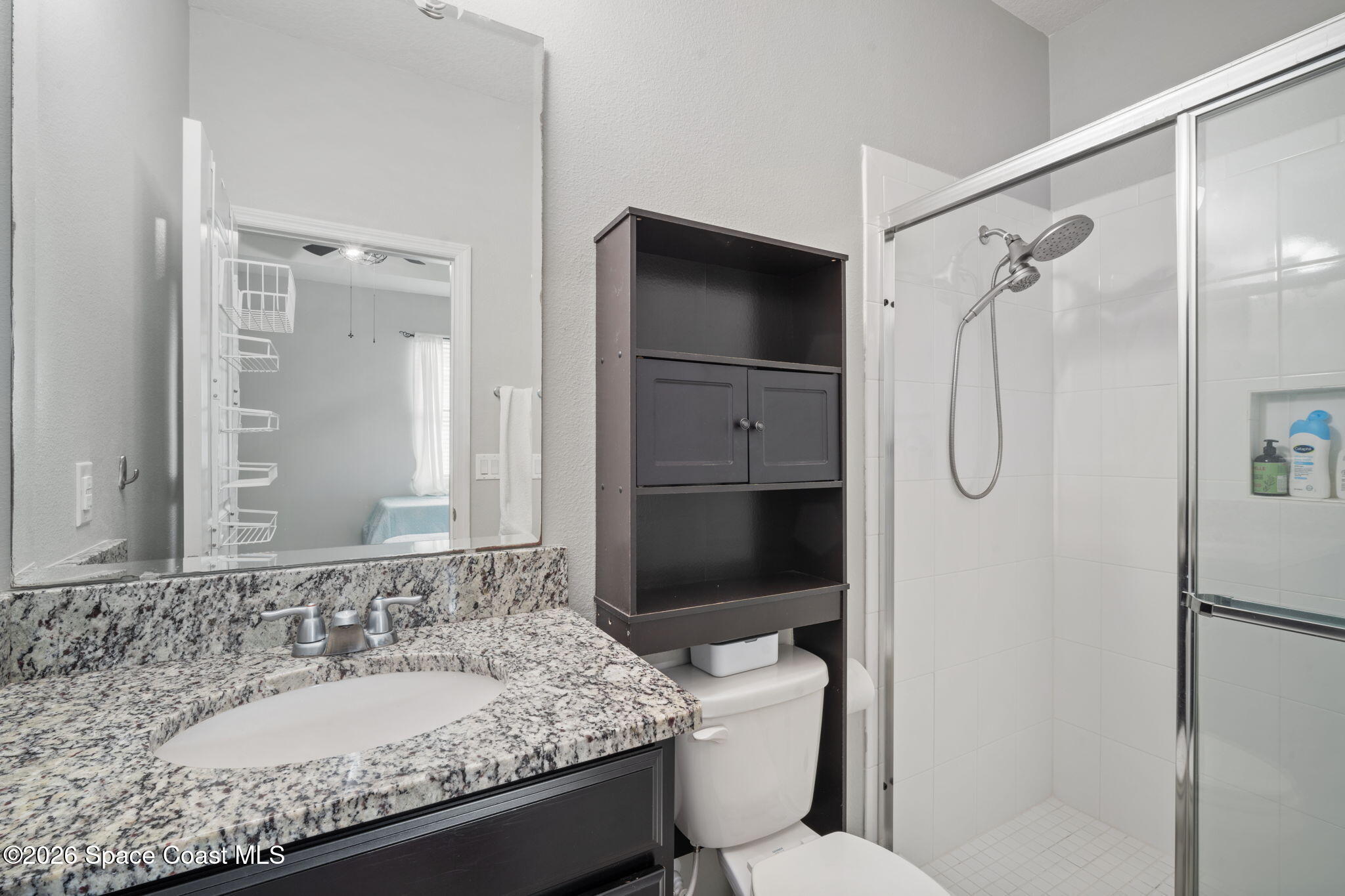 1941 Partin Terrace Road Kissimmee, FL 34744 - Photo 30 of 36 a bathroom with a granite countertop sink toilet and shower