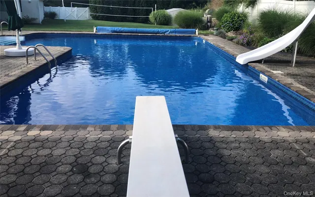 a wooden floor with a bench in front of it