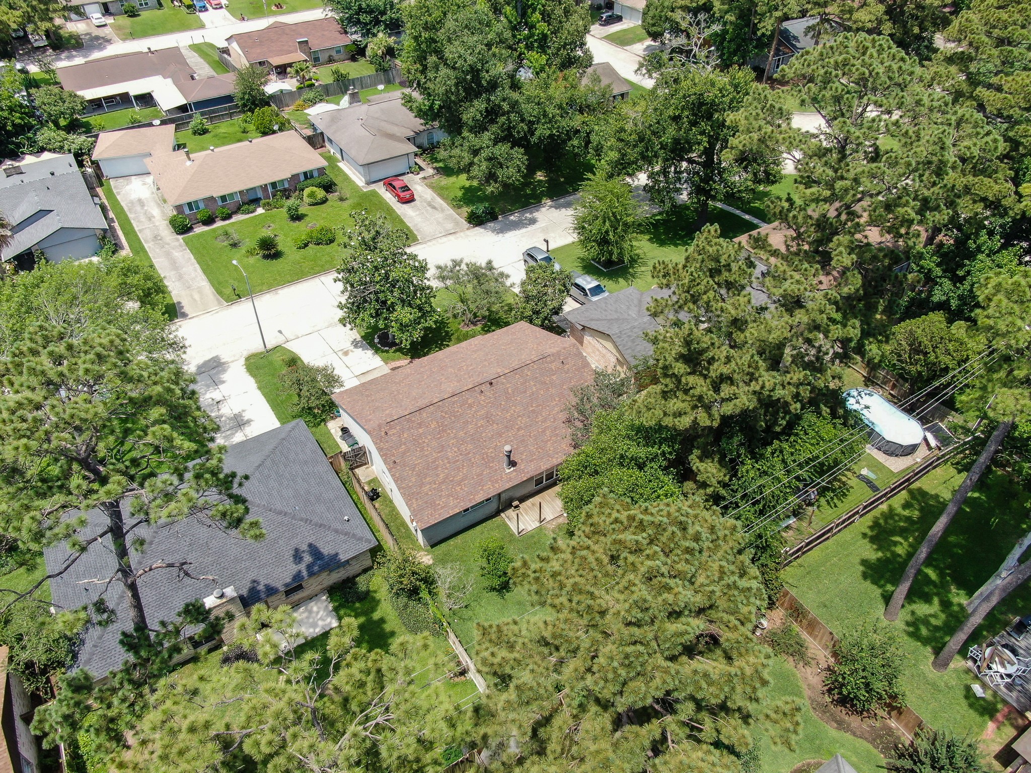 4314 Enchantedgate Drive Spring, TX 77373 - Photo 41 of 47 Aerial photo features a suburban neighborhood with single-story homes surrounded by lush greenery.
.