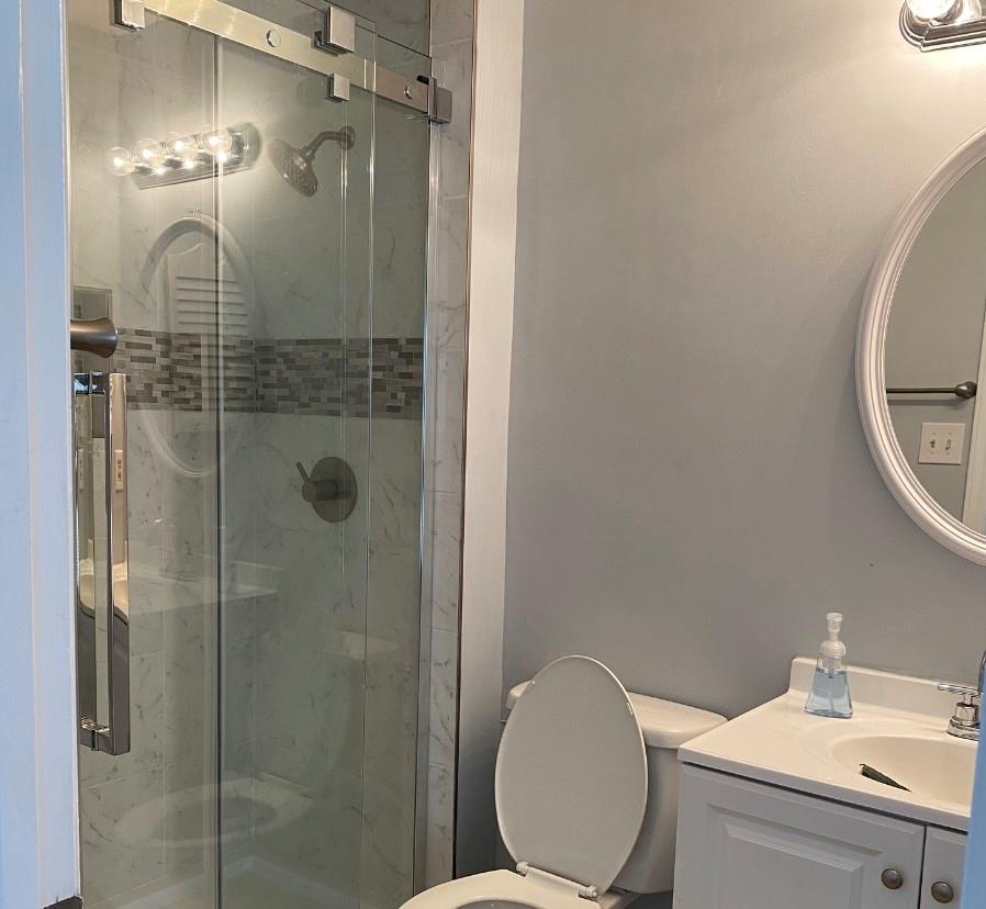 11111 Harrowfield Road Charlotte, NC 28226 - Photo 11 of 26 a bathroom with a toilet a sink and shower