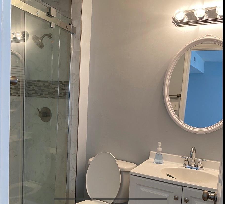 11111 Harrowfield Road Charlotte, NC 28226 - Photo 12 of 26 a bathroom with a sink mirror vanity and toilet