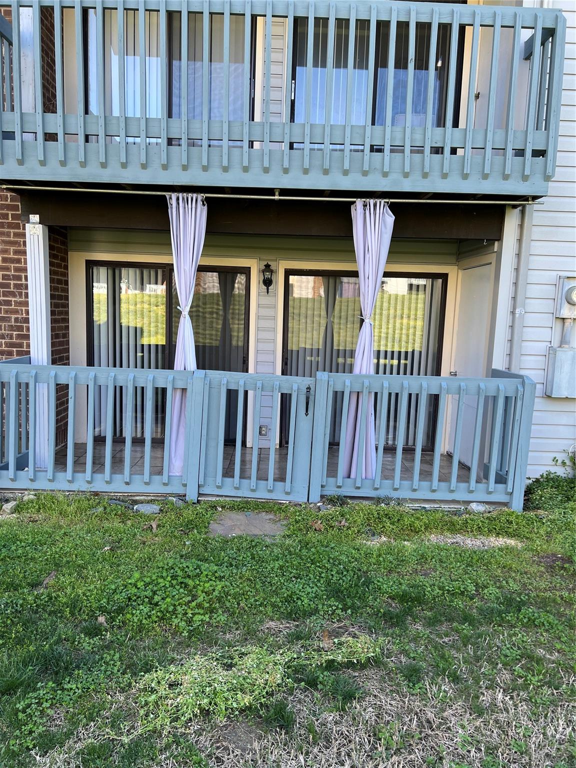 11111 Harrowfield Road Charlotte, NC 28226 - Photo 21 of 26 a view of a house with a wooden deck and a yard