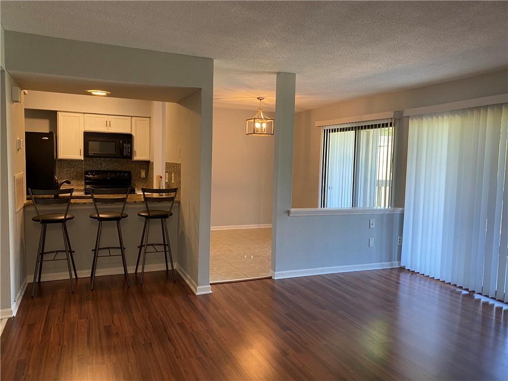 11111 Harrowfield Road Charlotte, NC 28226 - Photo 3 of 26 a view of a workspace with furniture and wooden floor