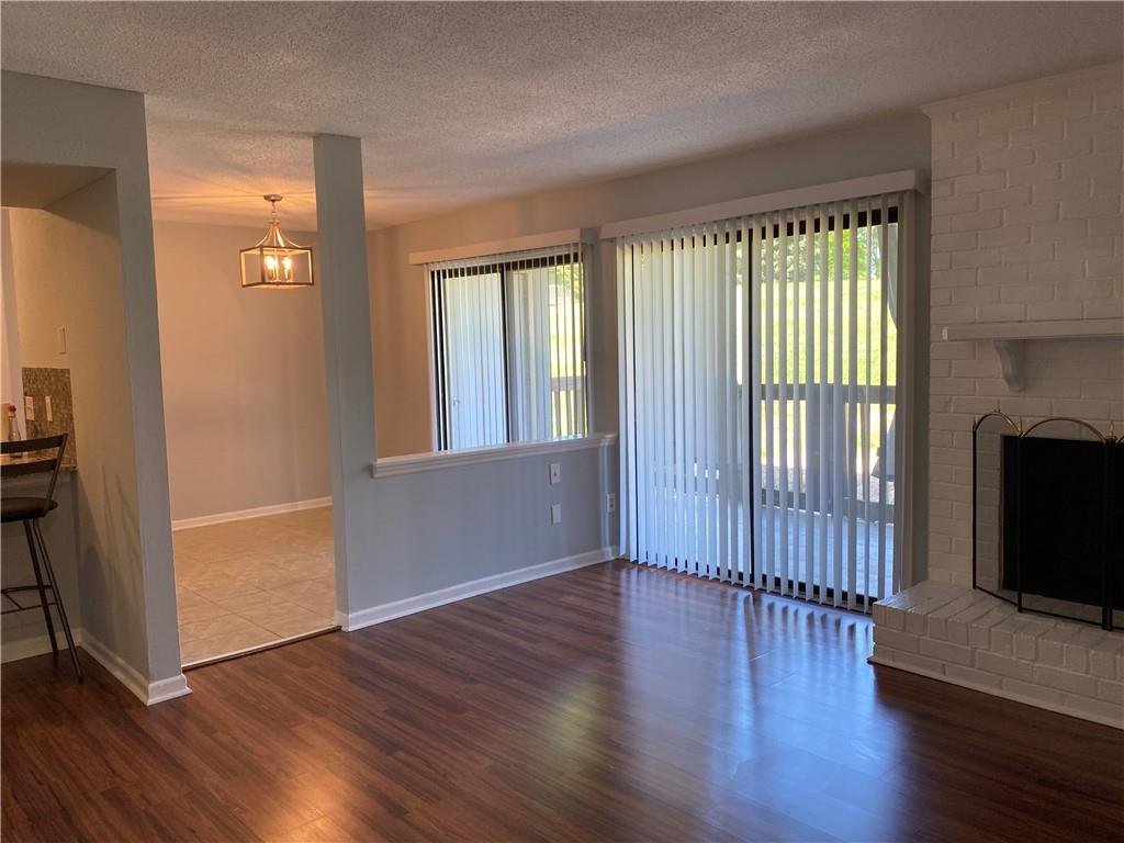 11111 Harrowfield Road Charlotte, NC 28226 - Photo 9 of 26 an empty room with wooden floor and windows