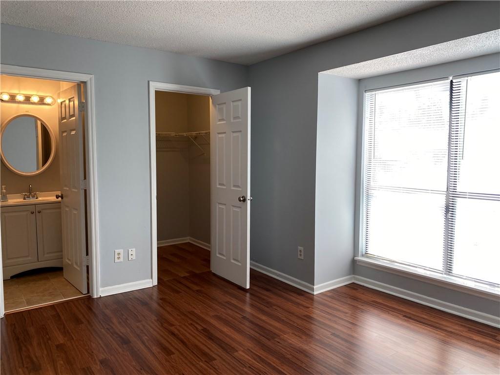11111 Harrowfield Road Charlotte, NC 28226 - Photo 10 of 26 an empty room with wooden floor and windows