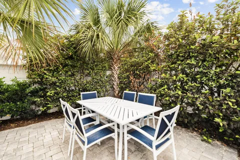 a bathroom with a granite countertop sink toilet a mirror and shower