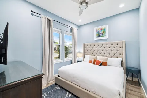 a bedroom with bunk bed and a dresser