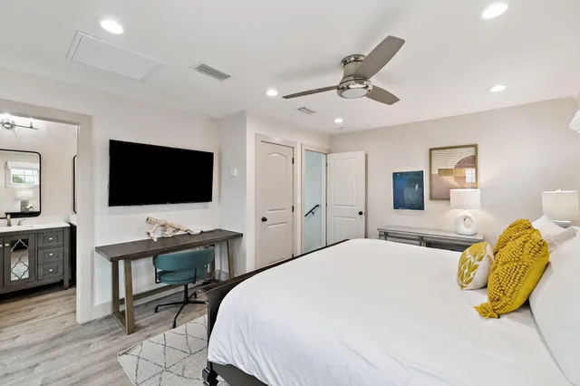 a bedroom with furniture and a book shelf