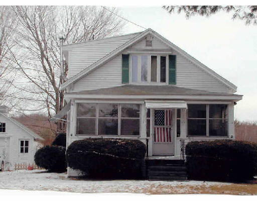 46 Bennett Road Hampden, MA 01036 - Photo 1 of 1 a view of a house with a large window and potted plants