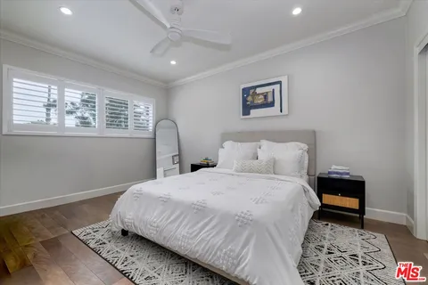 a bedroom with bed and a window