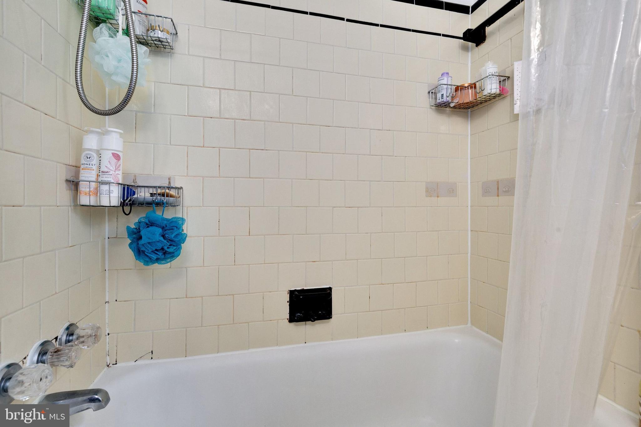 12114 Dalewood Drive Silver Spring, MD 20902 - Photo 14 of 24 a bathroom with a shower